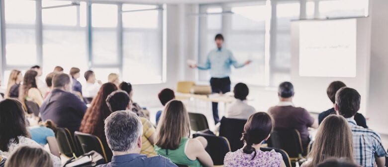 Speaker Giving a Talk at Business Meeting.