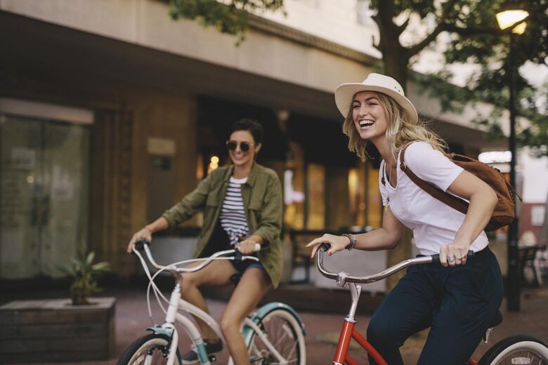 Female friends enjoying bicycle ride