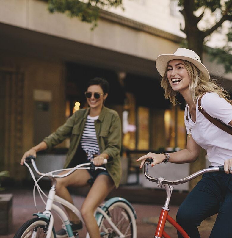 Female friends enjoying bicycle ride