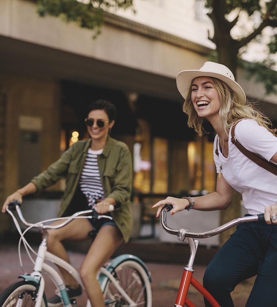 Female friends enjoying bicycle ride