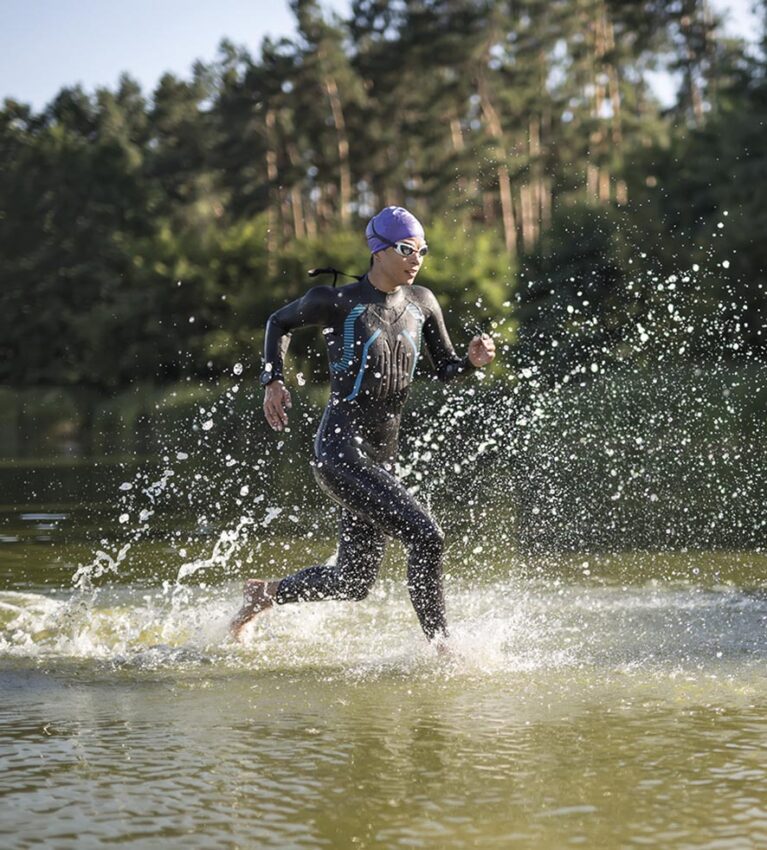 Sportive girl runs on the water