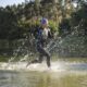Sportive girl runs on the water