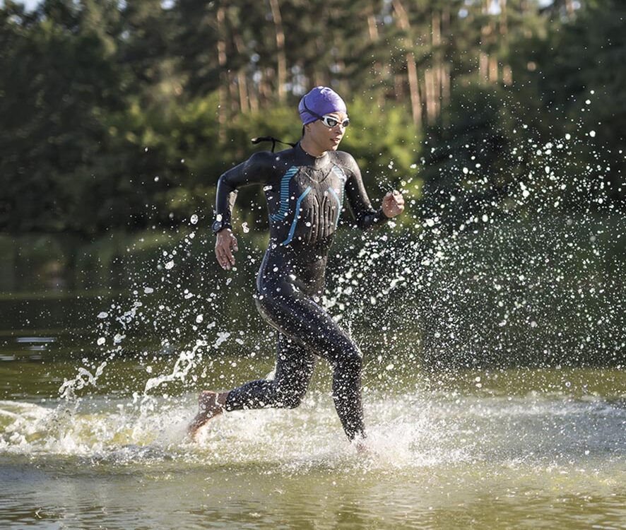 Sportive girl runs on the water