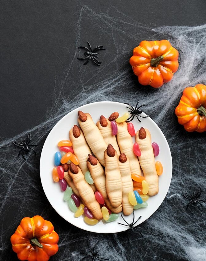 Happy halloween holiday concept. Cookies in form of witches fing