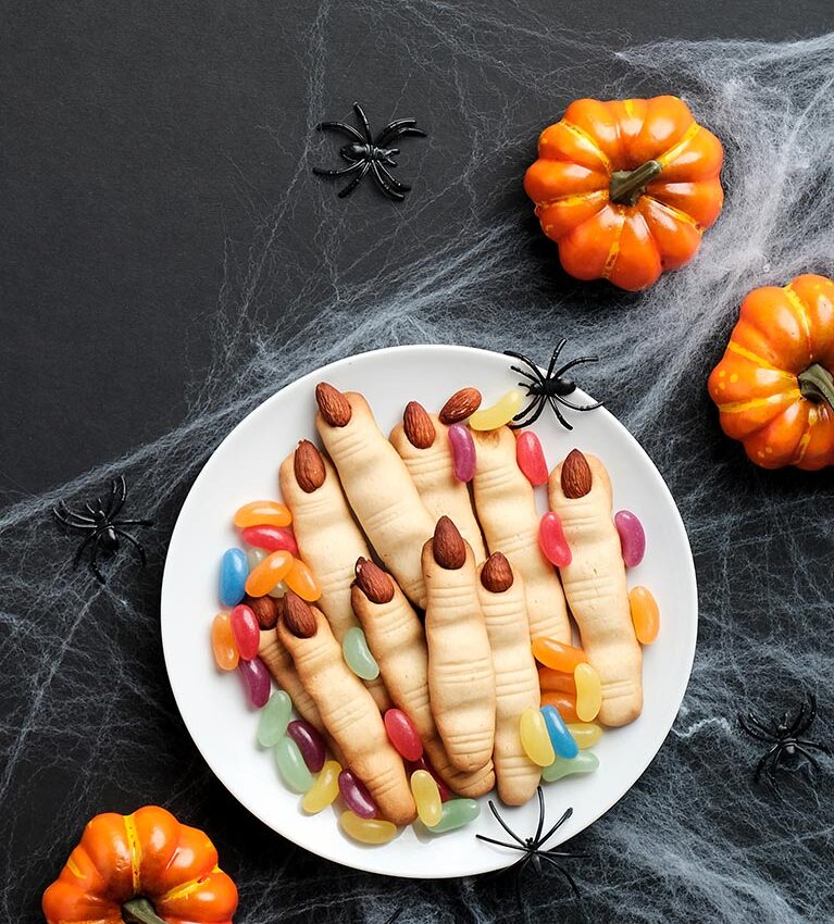 Happy halloween holiday concept. Cookies in form of witches fing