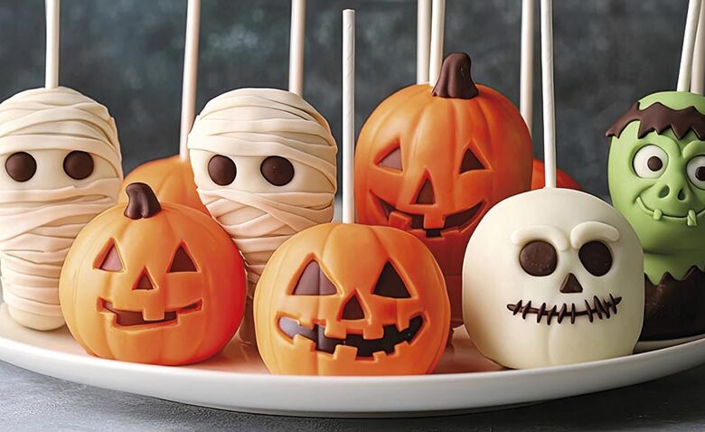 A plate of Halloween themed cake pops shaped like mummies, Frank